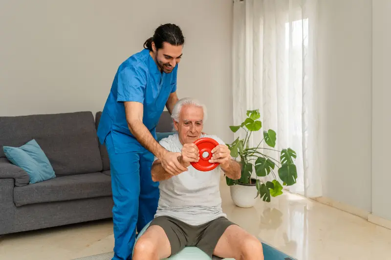 Male physiotherapist assisting senior man exercisi 2025 04 27 05 00 53 utc